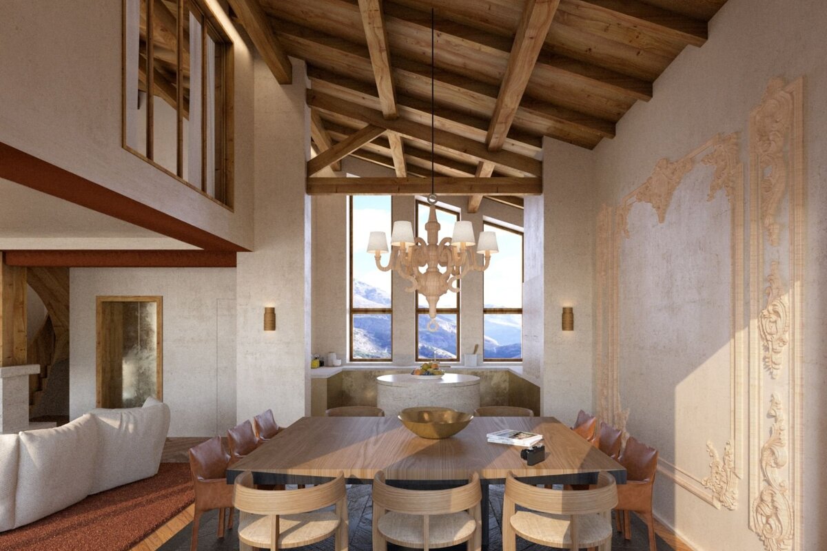 A spacious, rustic-modern dining room with vaulted wooden beams, a chandelier, and a large table. Stunning mountain views through tall windows and intricate wall carvings.