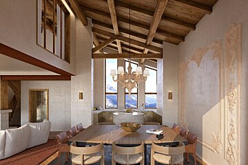 A spacious, rustic-modern dining room with vaulted wooden beams, a chandelier, and a large table. Stunning mountain views through tall windows and intricate wall carvings.