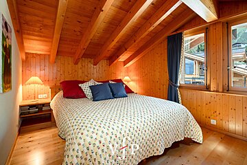 A bedroom with a bed and a window with vip written on the bottom