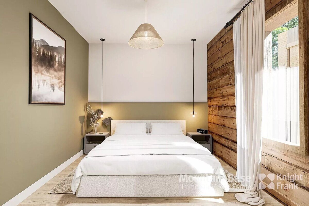 A bedroom with a bed and a picture on the wall that says knight frank