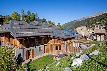 A house with a roof that has shingles on it