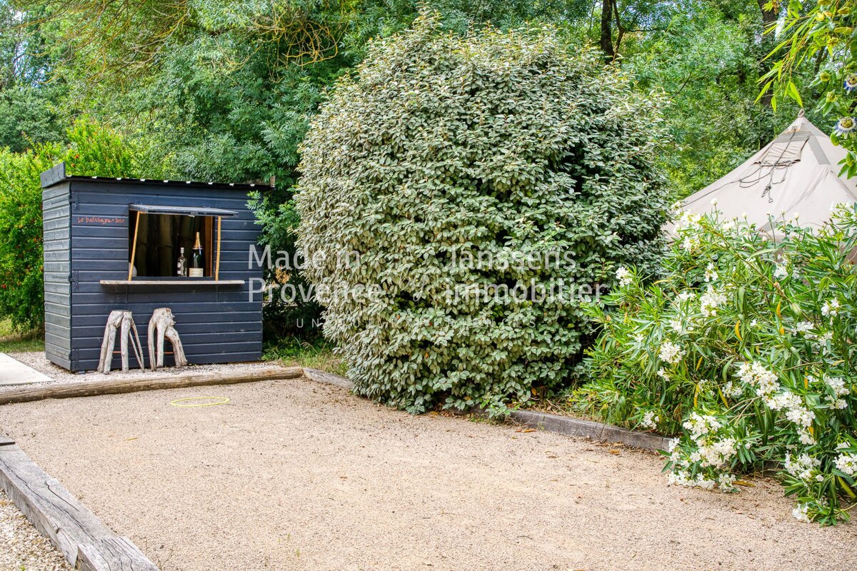 A black shed with the words made in provence written on it