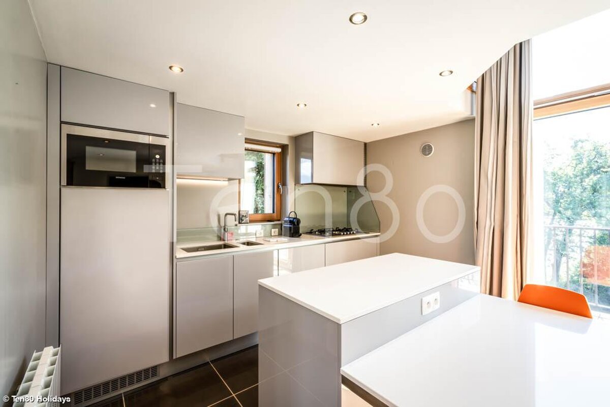 A kitchen with the number 80 on the wall