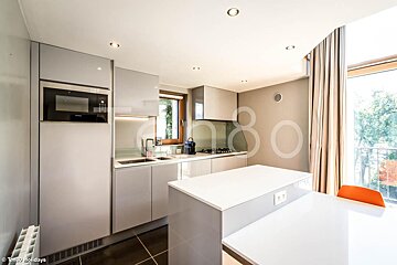 A kitchen with the number 80 on the wall