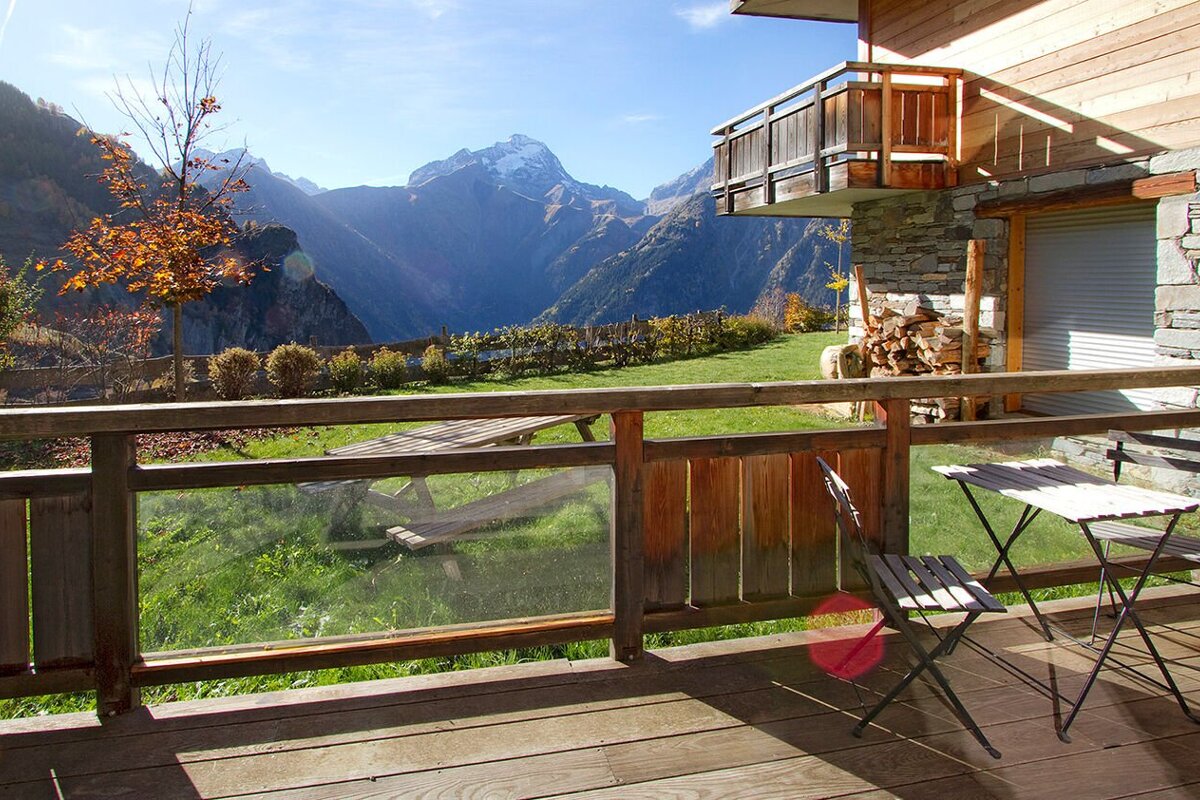 A balcony with a view of a mountain range