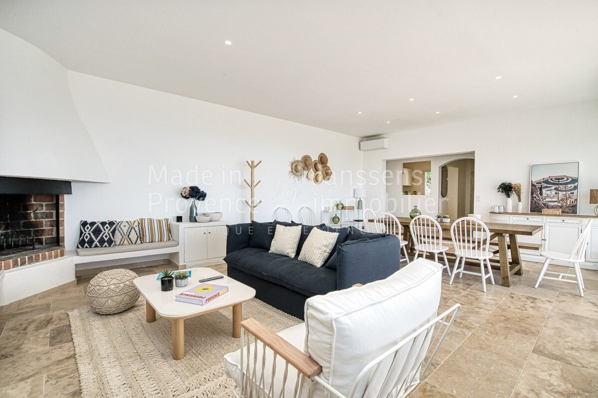 A living room with a couch and chairs and a sign that says made in provence