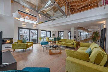 A living room filled with furniture and a fireplace