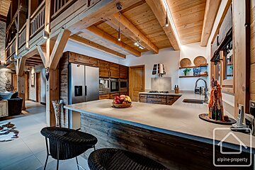 A kitchen with a sign that says alpine property