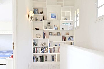 A bookshelf with a picture of a fish on it