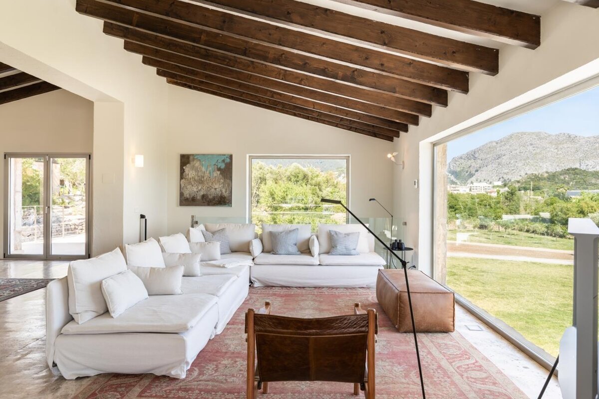 A living room with a large couch and a chair