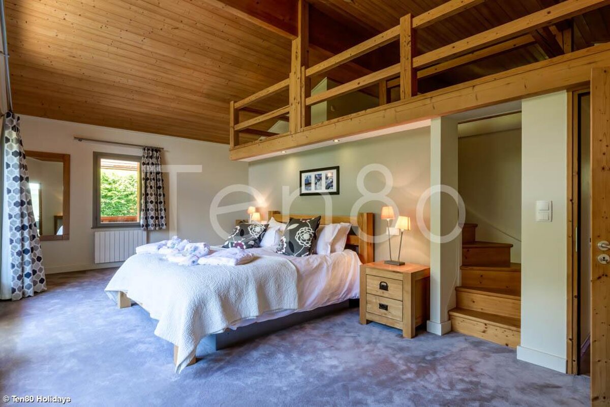 A bedroom with the number 80 on the wall