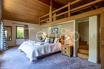 A bedroom with the number 80 on the wall