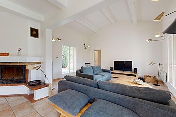 A living room with a fireplace and a couch