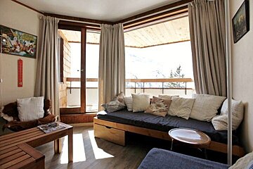 A living room with a couch and a table