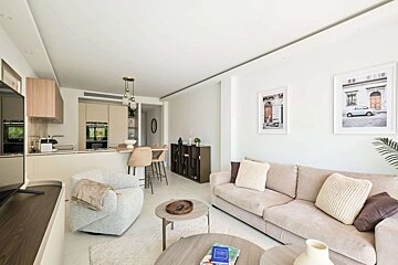 A living room with a couch a chair and a television