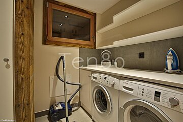 A laundry room with a bosch washer and dryer