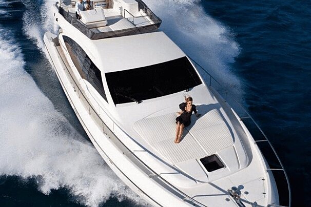 A woman is laying on the deck of a boat