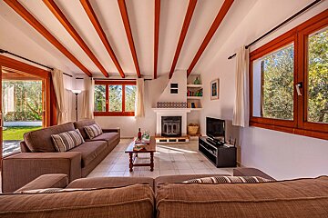 A living room with a fireplace and a television