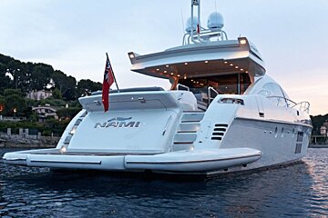A white yacht with the name nami on the back