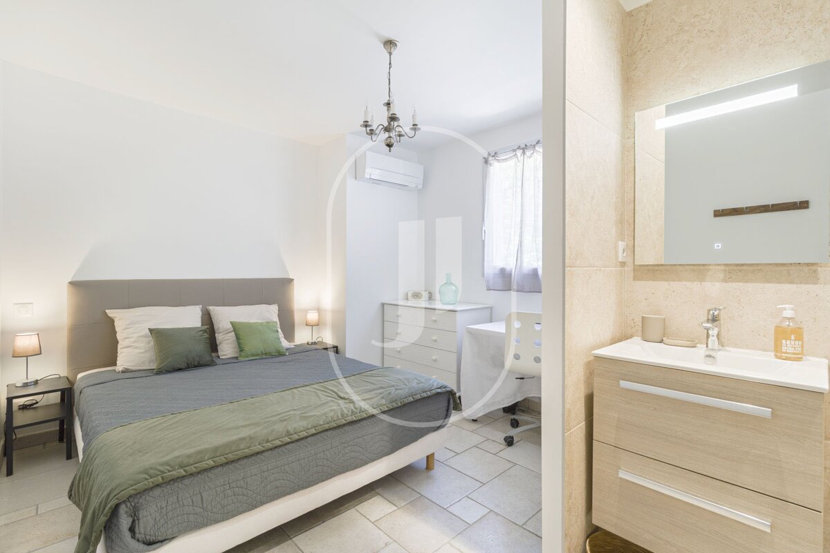 A bathroom with a sink and a bottle of hand soap