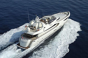 A large white yacht is floating in the ocean