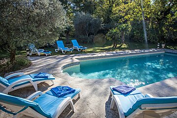 A swimming pool with a greek key design on the edge