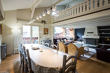 A dining room table with a polka dot table cloth