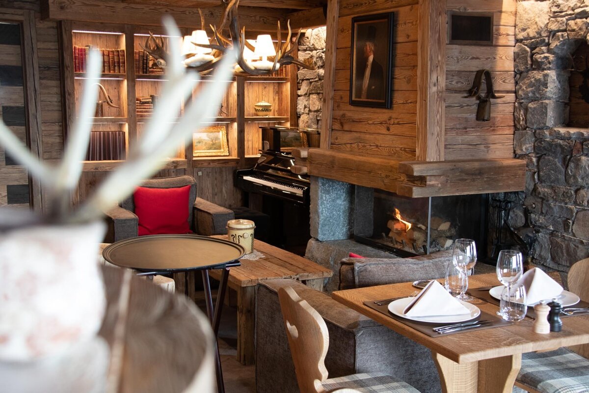 A room with a fireplace and a piano in it