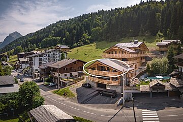 An aerial view of a house with a white circle around it
