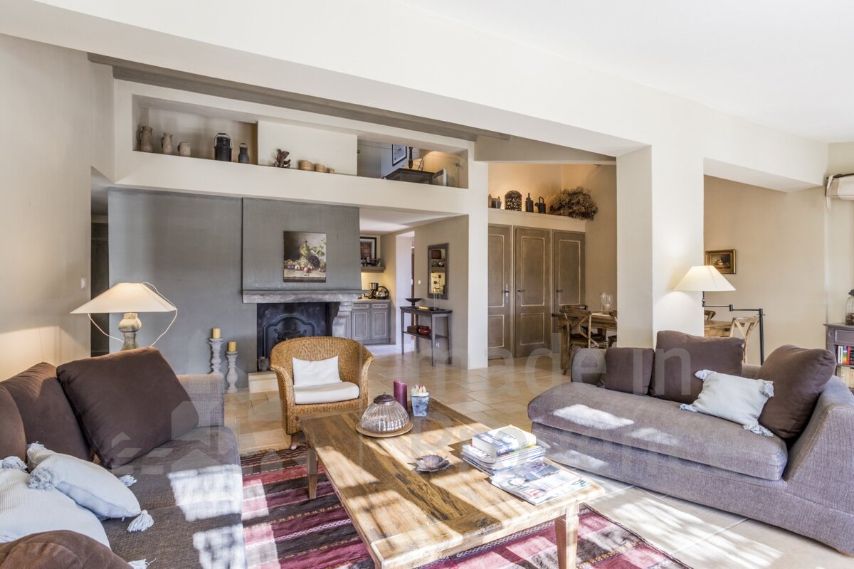 A living room with a couch a chair and a coffee table