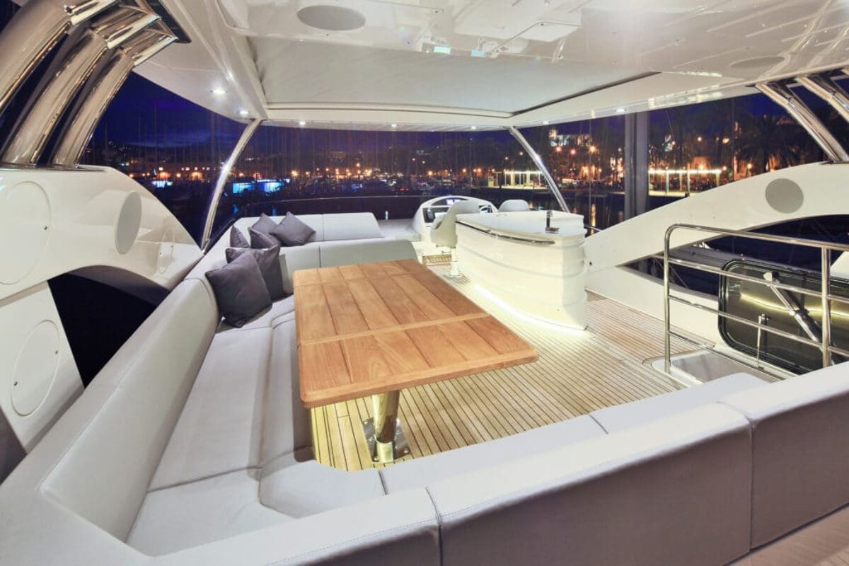 The inside of a boat with a table and couch