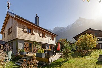 A house with a satellite dish on top of it