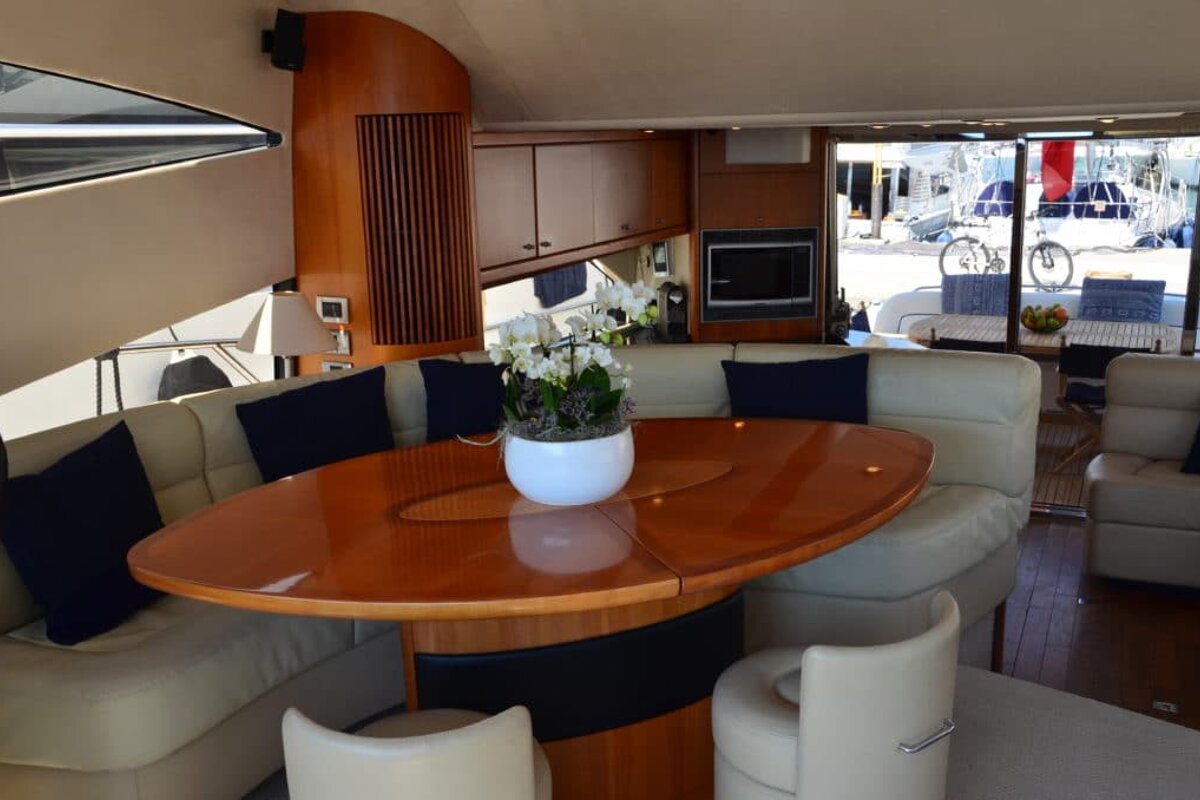 A table with a vase of flowers on it in a living room