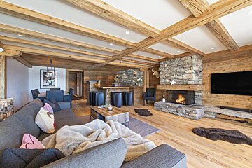 A living room with a couch and a fireplace