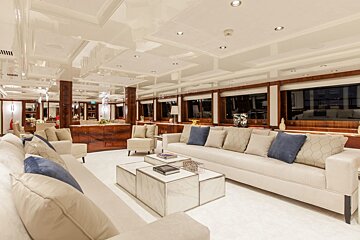 A living room with a couch and two coffee tables
