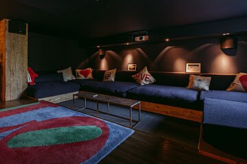 A couch with a pillow that says love on it