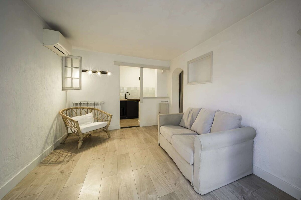 A living room with a couch and a chair