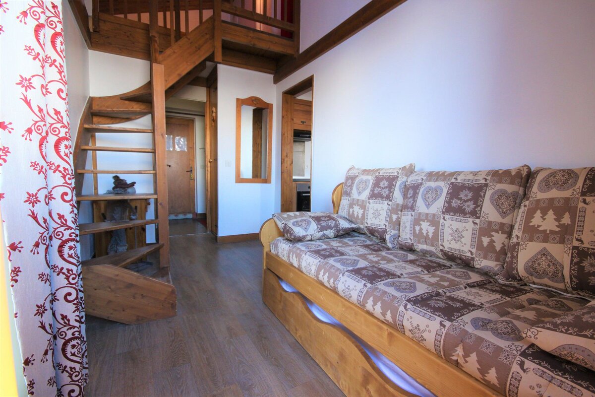 A wooden staircase leading up to the second floor of a house