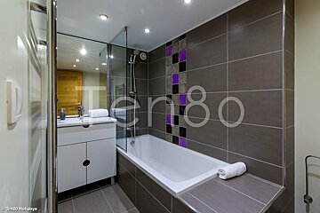 A bathroom with the number 80 on the wall