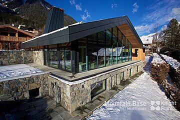 A house with a lot of windows is owned by knight frank
