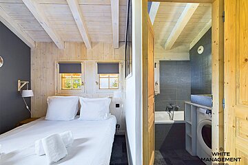 A hallway with wood paneling and a sign that says rental design