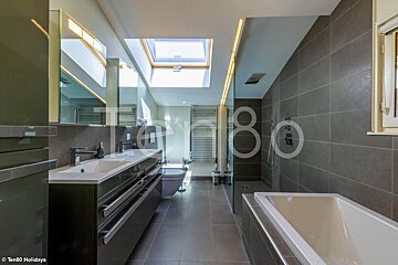 A bathroom with the number 80 on the wall