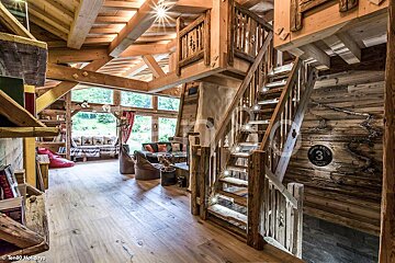 A wooden staircase leading up to the second floor of a house