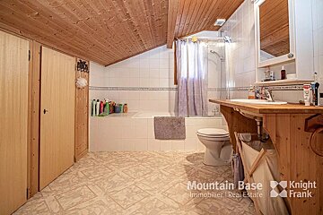 A bathroom with the words mountain base knight frank on the bottom