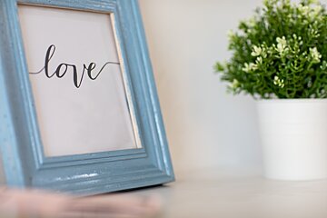 A picture frame with the word love written on it