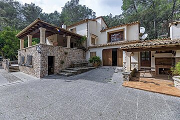 A house with a satellite dish on the top of it
