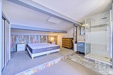 A bedroom with a bed and a mattress that says king on it