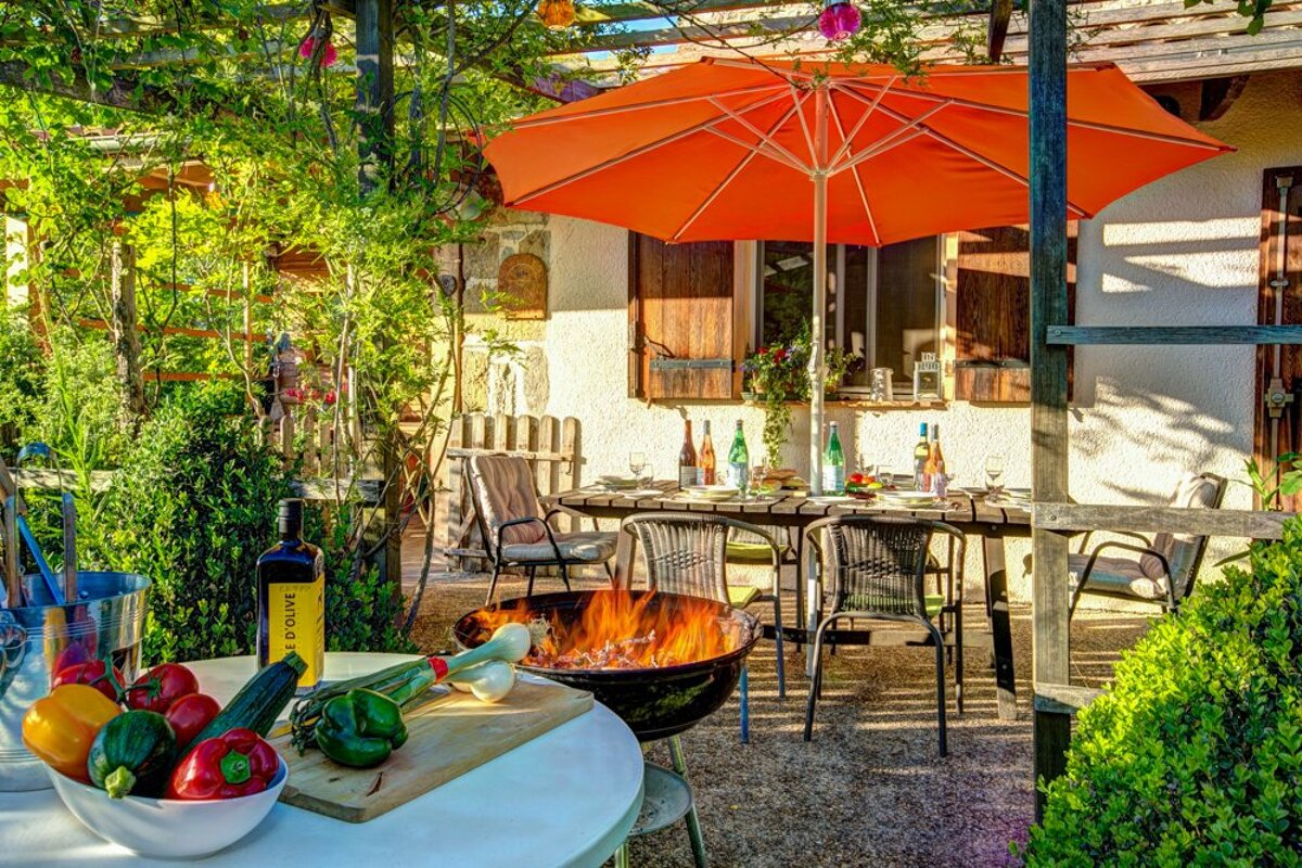 A bottle of extra virgin olive oil sits on a table