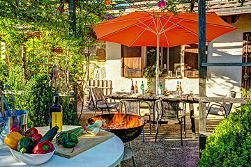A bottle of extra virgin olive oil sits on a table