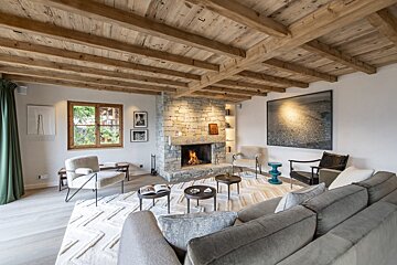 A living room with a fireplace and a couch